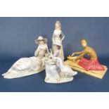 Two Lladro Daisa figures one of a woman in Spanish costume, 32.5 cm tall the other of a goose girl