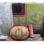 Collection of mixed vintage textiles including a fringed bed cover with pink embroidered cherubs