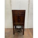 A Georgian mahogany foldover top gentleman's wash stand, the front elevation enclosed by central