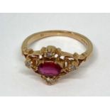 9ct ruby and diamond quatrefoil ring, size K/L, 2.2g