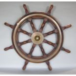 A vintage hardwood ships wheel with brass fittings 3ft in diameter (overall size)