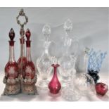 Good quality graduated pair of cut glass ewers with stoppers, rose cut decoration and baluster form,