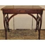 A late 19th century American oak travelling writing table fitted with two shallow frieze drawers,