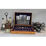 A mixed lot of silver plate comprising a seven glass bottle cruet and stand, lancet toast rack,
