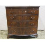 An Edwardian mahogany bow fronted chest of four long graduated drawers, together with a brush slide,