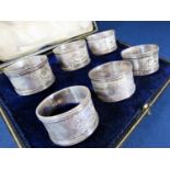 Good set of six Victorian silver napkin rings with engraved floral panels, maker marks indistinct,