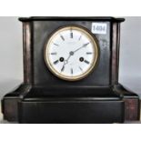 A good quality 19th century black slate architectural mantel clock, the enamel dial with twin