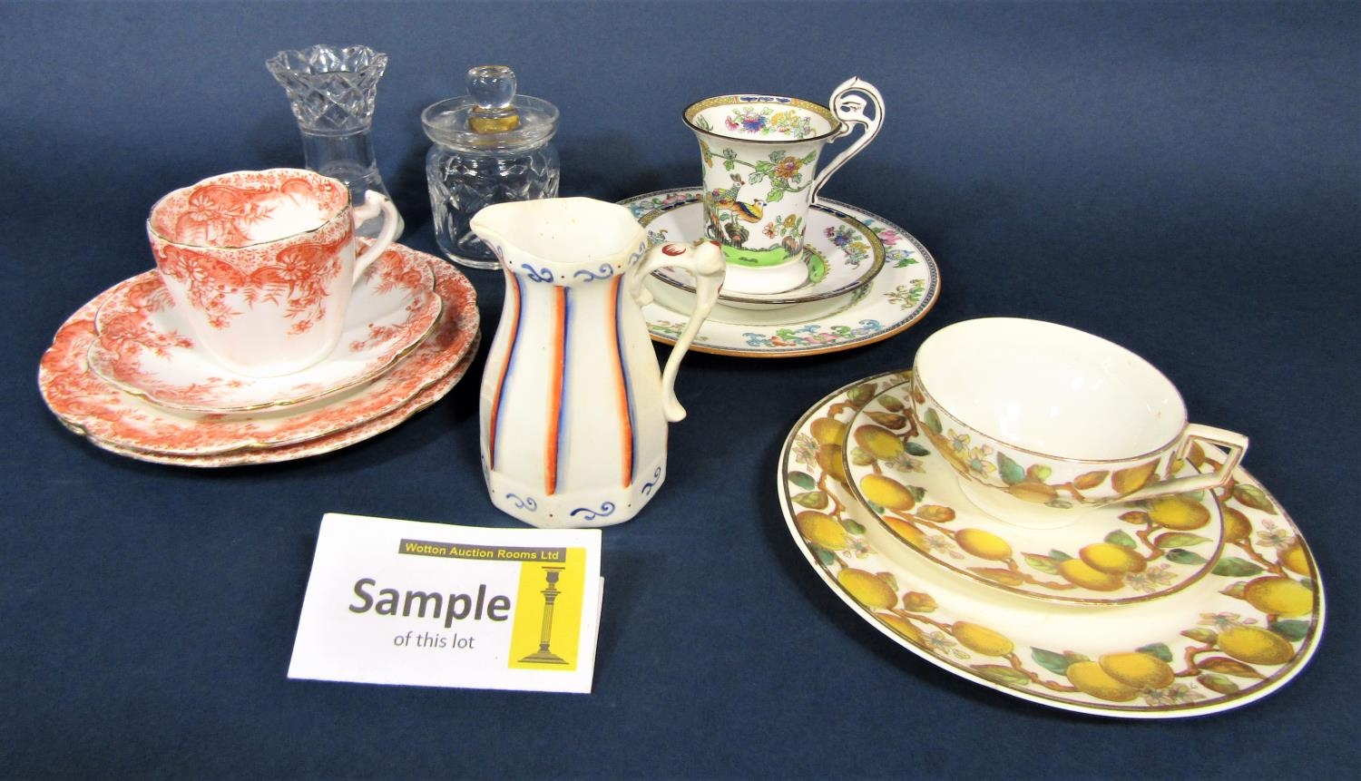 A collection of Foley china teawares with orange printed border decoration comprising milk jug, slop