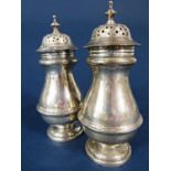 Pair of Edwardian baluster castors, with embossed band and stepped circular bases, maker William