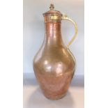 Eastern antique copper lidded ewer with brass handle and strapwork, 55cm high