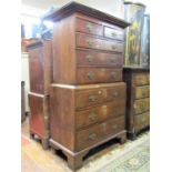 A small Georgian oak countryside chest on chest of six long and two short graduated drawers raised