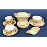 A collection of Royal Worcester blush ivory wares comprising a two handled oval basket with puce