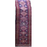 Good old Heriz runner with geometric medallion decoration upon a bluer ground, 310 x 80cm