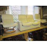 A Ekornes stressless three piece suite in white leather comprising a two seat sofa and a pair of