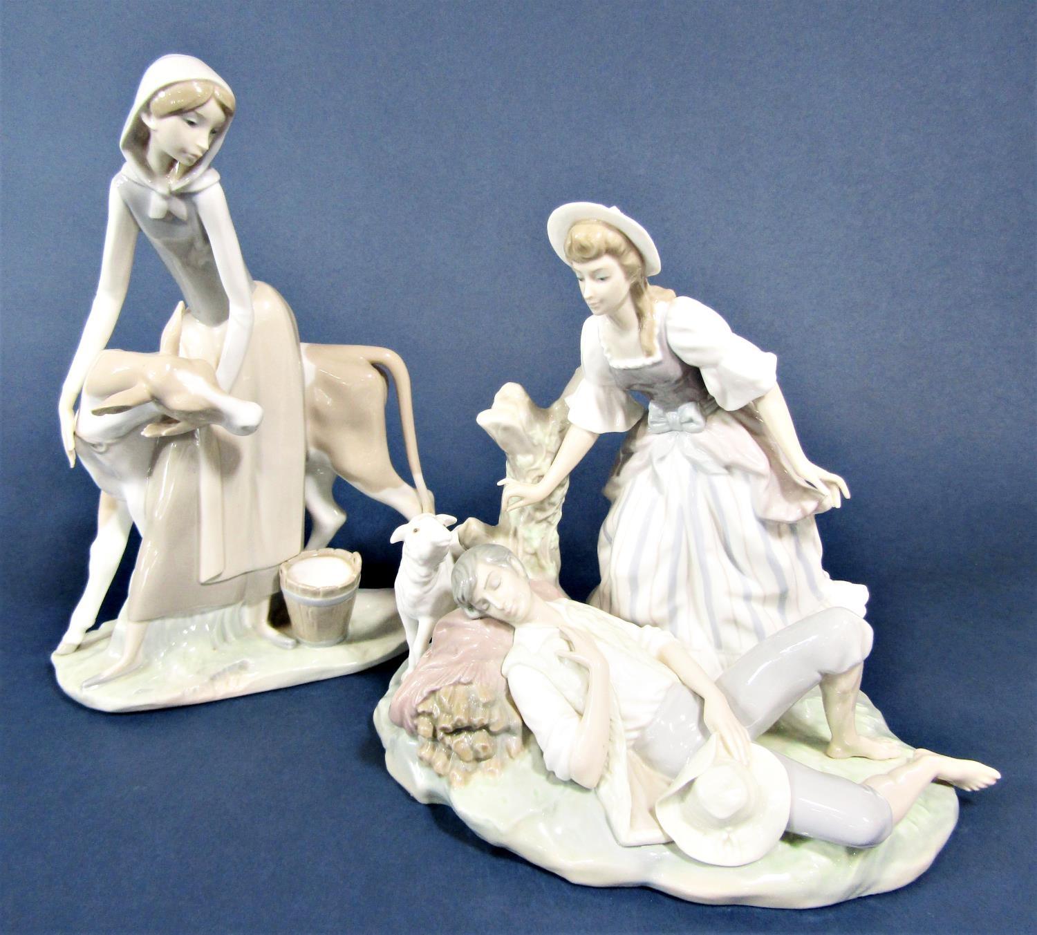A large Lladro figure group of a milkmaid and calf, 33.5cm tall approx, together with a further