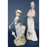 A Lladro figure of a young girl holding a parasol and with her skirt caught on a branch, 28cm tall