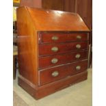 A Georgian mahogany bureau of four long graduated drawers, the fall flap enclosing a fitted interior