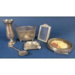 A mixed lot of silver comprising an ashtray, two silver applied easel frames, a small baluster vase,