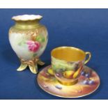 A Royal Worcester cabinet cup and saucer with finely painted fruit, the cup signed Ricketts, the