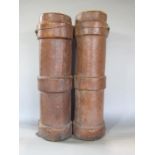 Leather wrapped twin artillery shell case, 63cm high