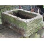 A reclaimed and well weathered garden trough of rectangular form with rounded front corners, 74 cm