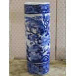 A Chinese blue and white cylindrical stick stand with bird and foliate decoration, 60cm high