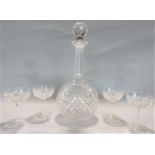 A good quality antique large hobnail cut glass decanter with faceted neck engraved with a crest of a