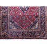 Good fine woven Kashan carpet with typical central blue floral medallion framed by further blue