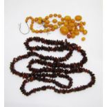 Quantity of amber coloured beads and a necklace
