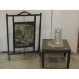 A oak framed fire screen enclosing a tapestry panel together with a small reproduction military