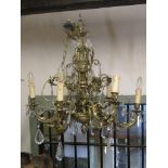 Cast gilt metal six branch chandelier with scrolling acanthus, reeded and foliate detail with