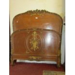 A late 19th century French oak single bedstead, the moulded head and footboard with decorative