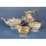 1930s silver four piece tea service of lobed boat-shaped form comprising teapot, water pot, milk jug
