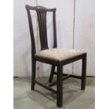 Four countrymade dining chairs, principally in fruit wood with simple pierced splats and upholstered