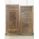 A pair of carved and pierced Chinese pine panels with repeating floral geometric work, 90cm high x