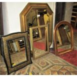 Four small contemporary wall mirrors of varying size and design with moulded frames