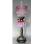Antique Corinthian column oil lamp with pink Vaseline glass type reservoir, 56cm high including