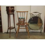 An Ercol stick back chair in beech and elm, a Doulton jardinière with crimped neck and an oak and
