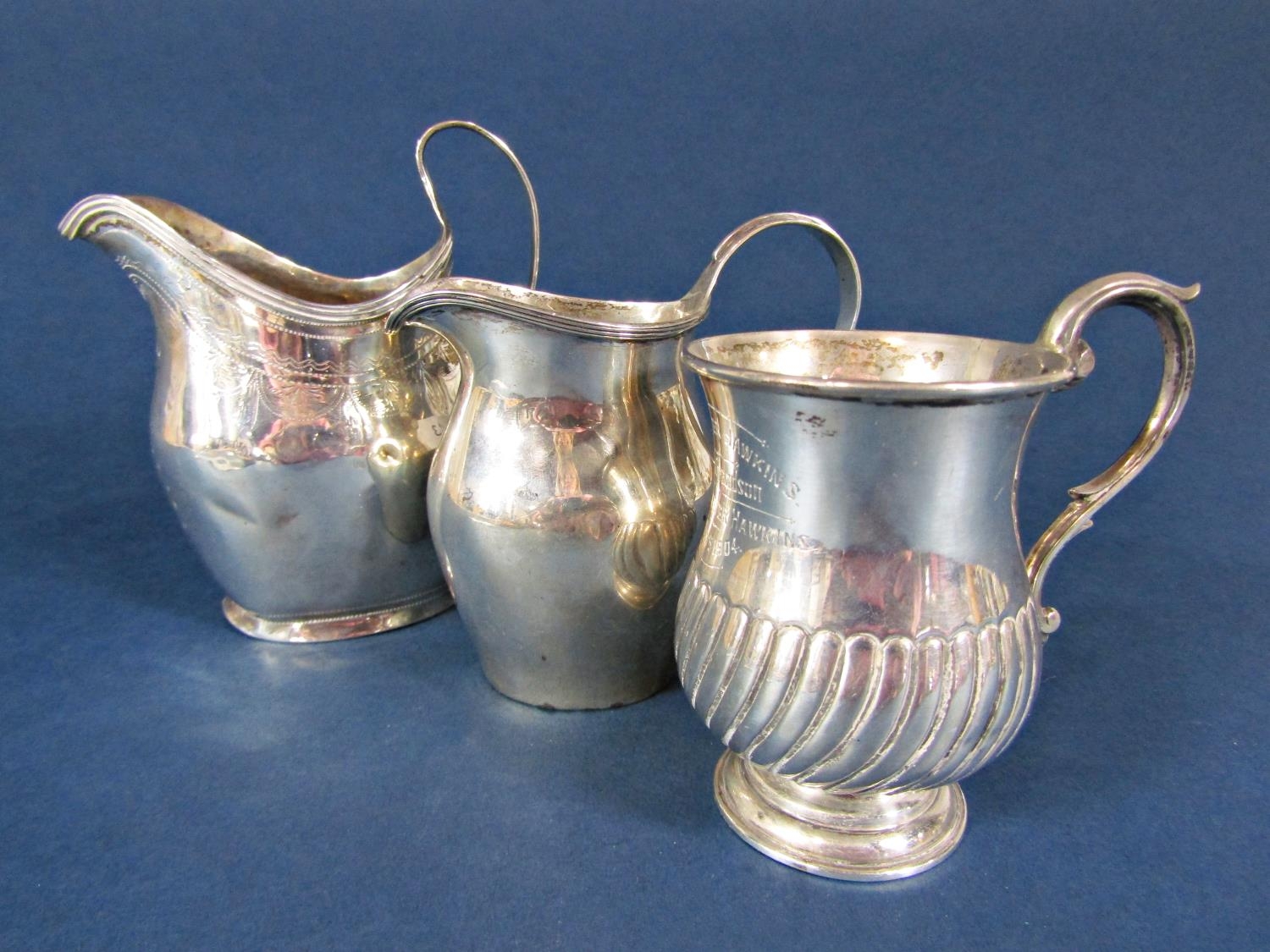 Georgian silver baluster cream jug, with engraved banded decoration, together with a further smaller