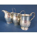 Georgian silver baluster cream jug, with engraved banded decoration, together with a further smaller