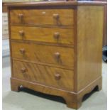 A 19th century satin walnut chest of four long graduated drawers on bracket supports, 65cm wide x