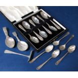 Mixed lot of silver spoons comprising two caddy spoons and smaller spoons and a cased set of six