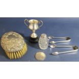 A mixed collection of silver to include a silver backed dressing brush, a small silver trophy, two