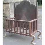 A cast iron fire basket of rectangualr form with arched back and shaped feet, 70cm wide approx (full