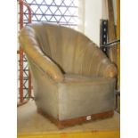 An Art Deco style low drawing room/bedroom chair with shell shaped back, leather upholstered