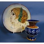 A Chelsea pottery dish with painted profile portrait of a young woman, signed with initial BR and