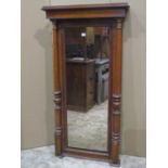 A 19th century continental mahogany pier glass of rectangular form with column supports, 140cm