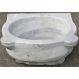 A white and grey veined marble mortar of oval form with projecting lugs, 47cm wide x 40cm deep x