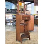 A late Victorian mahogany gentlemen's dressing table with swing rectangular mirror over a frieze