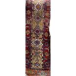 Unusual antique Afghan runner with various medallions upon a fawn ground, 160 x 60cm